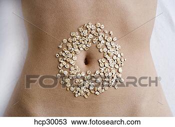 Stock Photo - young woman's 
torso with navel 
surrounded by 
oats. fotosearch 
- search stock 
photos, pictures, 
images, and photo 
clipart