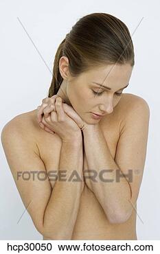 Stock Photography - young woman standing 
with arms crossed. 
fotosearch - search 
stock photos, 
pictures, images, 
and photo clipart