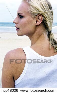 Stock Photo - woman posing at 
beach. fotosearch 
- search stock 
photos, pictures, 
images, and photo 
clipart