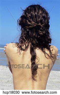 Stock Photography - woman’s bare back 
at beach. fotosearch 
- search stock 
photos, pictures, 
images, and photo 
clipart