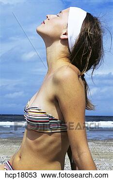 Stock Photo - woman sunbathing 
at beach. fotosearch 
- search stock 
photos, pictures, 
images, and photo 
clipart