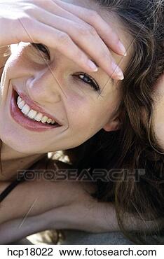 Stock Photo - young woman smiling. 
fotosearch - search 
stock photos, 
pictures, images, 
and photo clipart