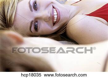 Stock Image - young woman smiling. 
fotosearch - search 
stock photos, 
pictures, images, 
and photo clipart