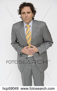 Stock Photograph - businessman holding 
his stomach. fotosearch 
- search stock 
photos, pictures, 
images, and photo 
clipart