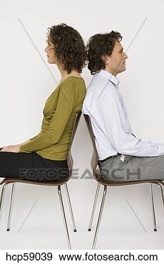 Stock Photograph - couple sitting 
back to back. 
fotosearch - search 
stock photos, 
pictures, images, 
and photo clipart