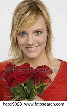 Stock Photo - woman holding 
bouquet of roses. 
fotosearch - search 
stock photos, 
pictures, images, 
and photo clipart