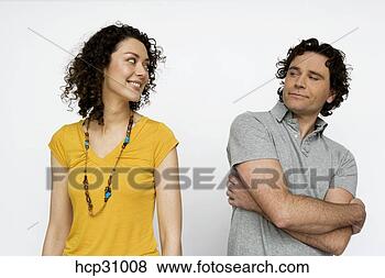 Stock Photo - young couple looking 
at each other. 
fotosearch - search 
stock photos, 
pictures, images, 
and photo clipart