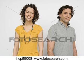 Stock Photo - young couple looking 
at each other 
questioningly. 
fotosearch - search 
stock photos, 
pictures, images, 
and photo clipart