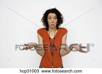 Stock Photo - young woman shrugging. 
fotosearch - search 
stock photos, 
pictures, images, 
and photo clipart