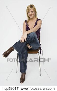 Picture - young woman sitting 
in chair. fotosearch 
- search stock 
photos, pictures, 
images, and photo 
clipart