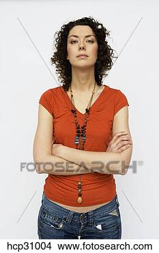 Stock Photo - young woman standing 
with arms crossed. 
fotosearch - search 
stock photos, 
pictures, images, 
and photo clipart