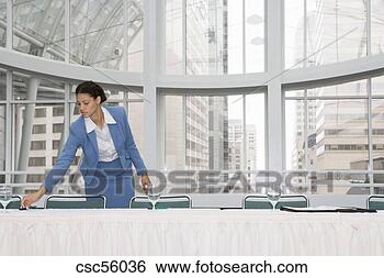 Stock Photo - african businesswoman 
picking up paperwork. 
fotosearch - search 
stock photos, 
pictures, images, 
and photo clipart