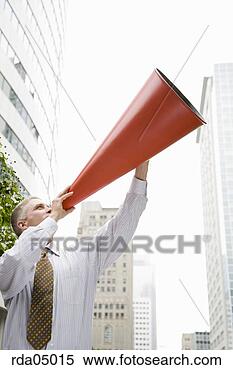 Stock Image - businessman yelling 
into megaphone. 
fotosearch - search 
stock photos, 
pictures, images, 
and photo clipart