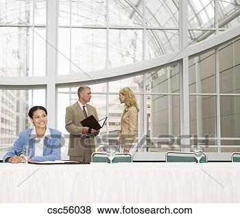 Stock Photo - businesspeople 
in conference 
area. fotosearch 
- search stock 
photos, pictures, 
images, and photo 
clipart