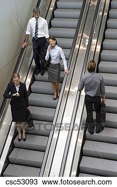 Stock Photo - businesspeople 
standing on escalators. 
fotosearch - search 
stock photos, 
pictures, images, 
and photo clipart