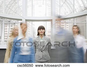 Stock Photography - businesswoman 
with hands behind 
back. fotosearch 
- search stock 
photos, pictures, 
images, and photo 
clipart