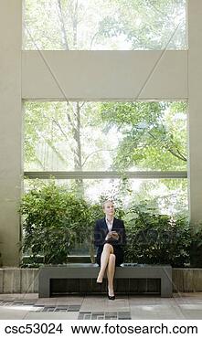 Stock Photo - businesswoman 
holding cell phone. 
fotosearch - search 
stock photos, 
pictures, images, 
and photo clipart