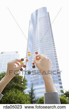 Stock Photo - businesswoman 
holding molecular 
model. fotosearch 
- search stock 
photos, pictures, 
images, and photo 
clipart