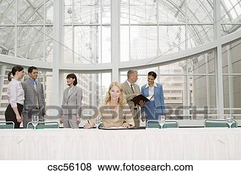 Stock Photo - businesswoman 
sitting at conference 
table. fotosearch 
- search stock 
photos, pictures, 
images, and photo 
clipart