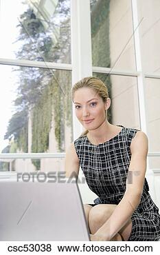 Stock Photo - businesswoman 
typing on laptop. 
fotosearch - search 
stock photos, 
pictures, images, 
and photo clipart