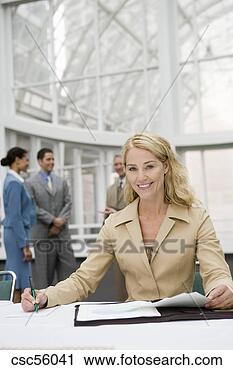 Stock Photography - businesswoman 
writing at table. 
fotosearch - search 
stock photos, 
pictures, images, 
and photo clipart