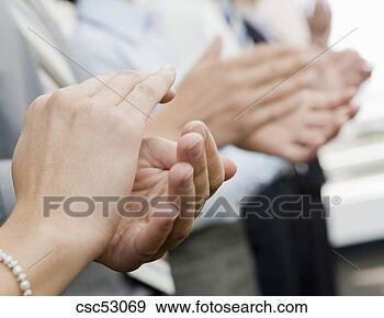 Stock Photograph - close up of businesspeople 
clapping. fotosearch 
- search stock 
photos, pictures, 
images, and photo 
clipart