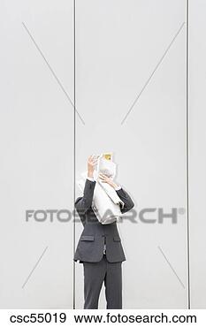 Stock Photograph - businessman holding 
newspaper. fotosearch 
- search stock 
photos, pictures, 
images, and photo 
clipart