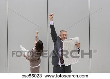 Stock Photo - businesspeople 
holding newspaper. 
fotosearch - search 
stock photos, 
pictures, images, 
and photo clipart