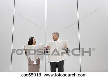 Stock Photo - businesspeople 
holding newspapers. 
fotosearch - search 
stock photos, 
pictures, images, 
and photo clipart