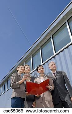 Stock Photo - businesspeople 
holding paperwork. 
fotosearch - search 
stock photos, 
pictures, images, 
and photo clipart