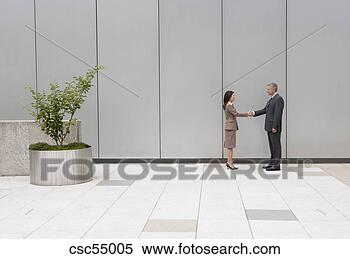 Stock Image - businesspeople 
shaking hands. 
fotosearch - search 
stock photos, 
pictures, images, 
and photo clipart