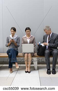 Stock Photograph - businesspeople 
sitting on bench. 
fotosearch - search 
stock photos, 
pictures, images, 
and photo clipart