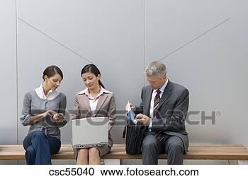 Stock Photography - businesspeople 
sitting on bench. 
fotosearch - search 
stock photos, 
pictures, images, 
and photo clipart