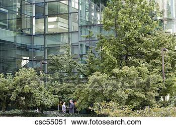 Stock Photography - businesspeople 
talking outdoors. 
fotosearch - search 
stock photos, 
pictures, images, 
and photo clipart