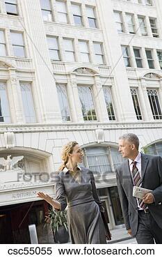 Stock Image - businesspeople 
talking outdoors. 
fotosearch - search 
stock photos, 
pictures, images, 
and photo clipart