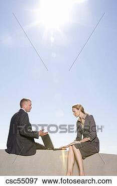 Picture - businesspeople 
talking outdoors. 
fotosearch - search 
stock photos, 
pictures, images, 
and photo clipart