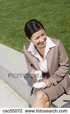 Stock Photo - businesswoman 
holding coffee 
mug. fotosearch 
- search stock 
photos, pictures, 
images, and photo 
clipart