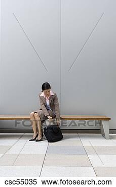 Stock Image - businesswoman 
putting away laptop. 
fotosearch - search 
stock photos, 
pictures, images, 
and photo clipart