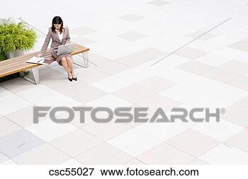 Picture - businesswoman 
sitting on bench. 
fotosearch - search 
stock photos, 
pictures, images, 
and photo clipart