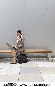 Stock Photo - businesswoman 
typing on laptop. 
fotosearch - search 
stock photos, 
pictures, images, 
and photo clipart