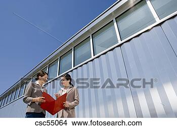 Stock Photo - businesswomen 
discussing paperwork. 
fotosearch - search 
stock photos, 
pictures, images, 
and photo clipart