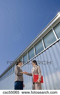 Stock Image - businesswomen 
shaking hands. 
fotosearch - search 
stock photos, 
pictures, images, 
and photo clipart