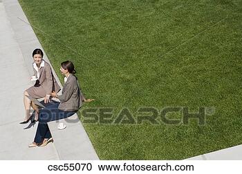 Stock Photography - businesswomen 
talking outdoors. 
fotosearch - search 
stock photos, 
pictures, images, 
and photo clipart