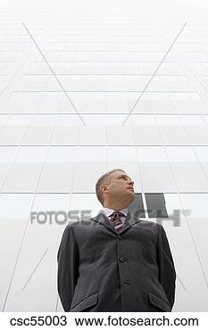Stock Photo - low angle view 
of businessman. 
fotosearch - search 
stock photos, 
pictures, images, 
and photo clipart