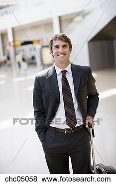 Stock Photo - businessman holding 
suitcase. fotosearch 
- search stock 
photos, pictures, 
images, and photo 
clipart