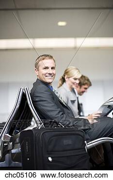 Stock Photo - businessman next 
to suitcase. fotosearch 
- search stock 
photos, pictures, 
images, and photo 
clipart
