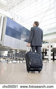 Stock Photography - businessman pulling 
suitcase. fotosearch 
- search stock 
photos, pictures, 
images, and photo 
clipart