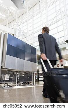 Stock Photo - businessman pulling 
suitcase. fotosearch 
- search stock 
photos, pictures, 
images, and photo 
clipart
