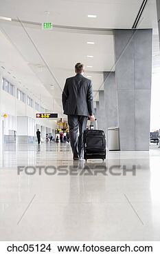 Stock Photo - businessman pulling 
suitcases. fotosearch 
- search stock 
photos, pictures, 
images, and photo 
clipart