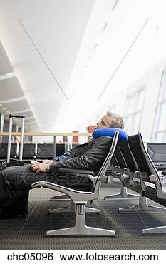 Stock Photo - businessman sleeping 
in waiting area. 
fotosearch - search 
stock photos, 
pictures, images, 
and photo clipart